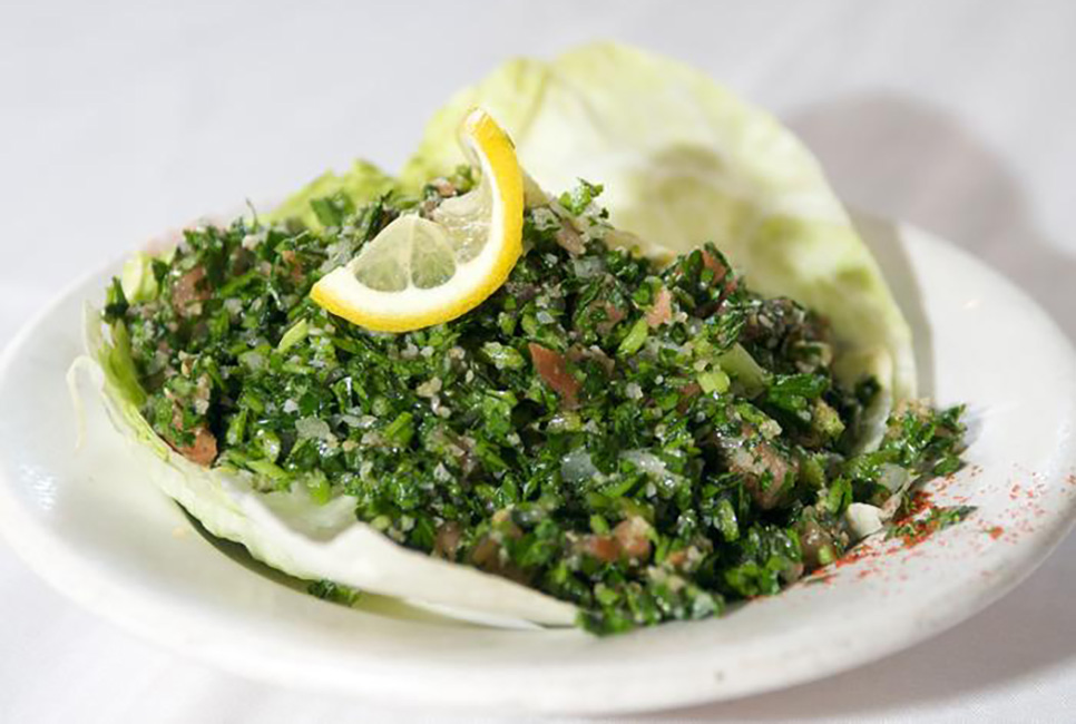 Special Lebanese salad made with chopped parsley, tomatoes, onions & cracked wheat
